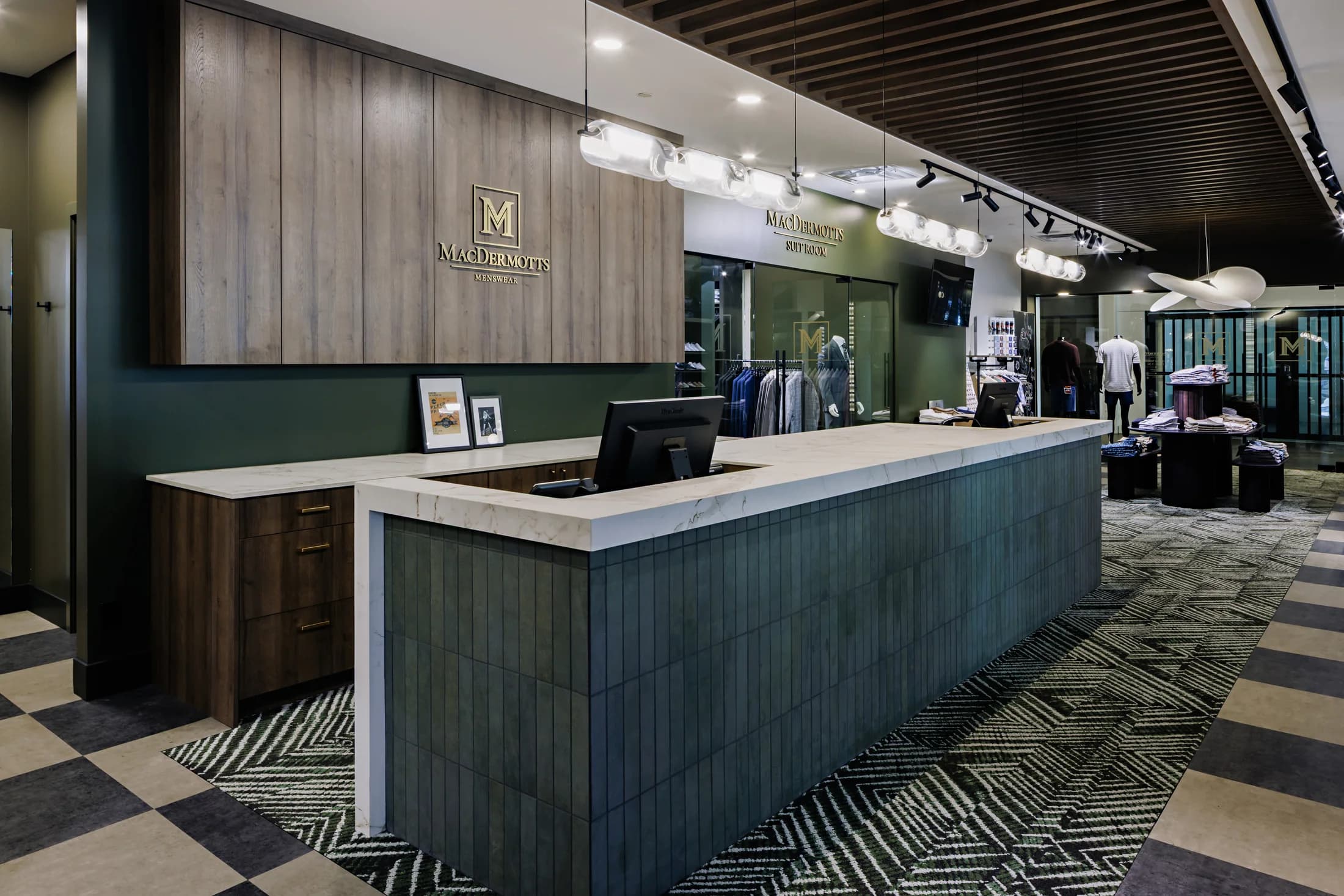 The marble consultation counter beneath wood slat panelling